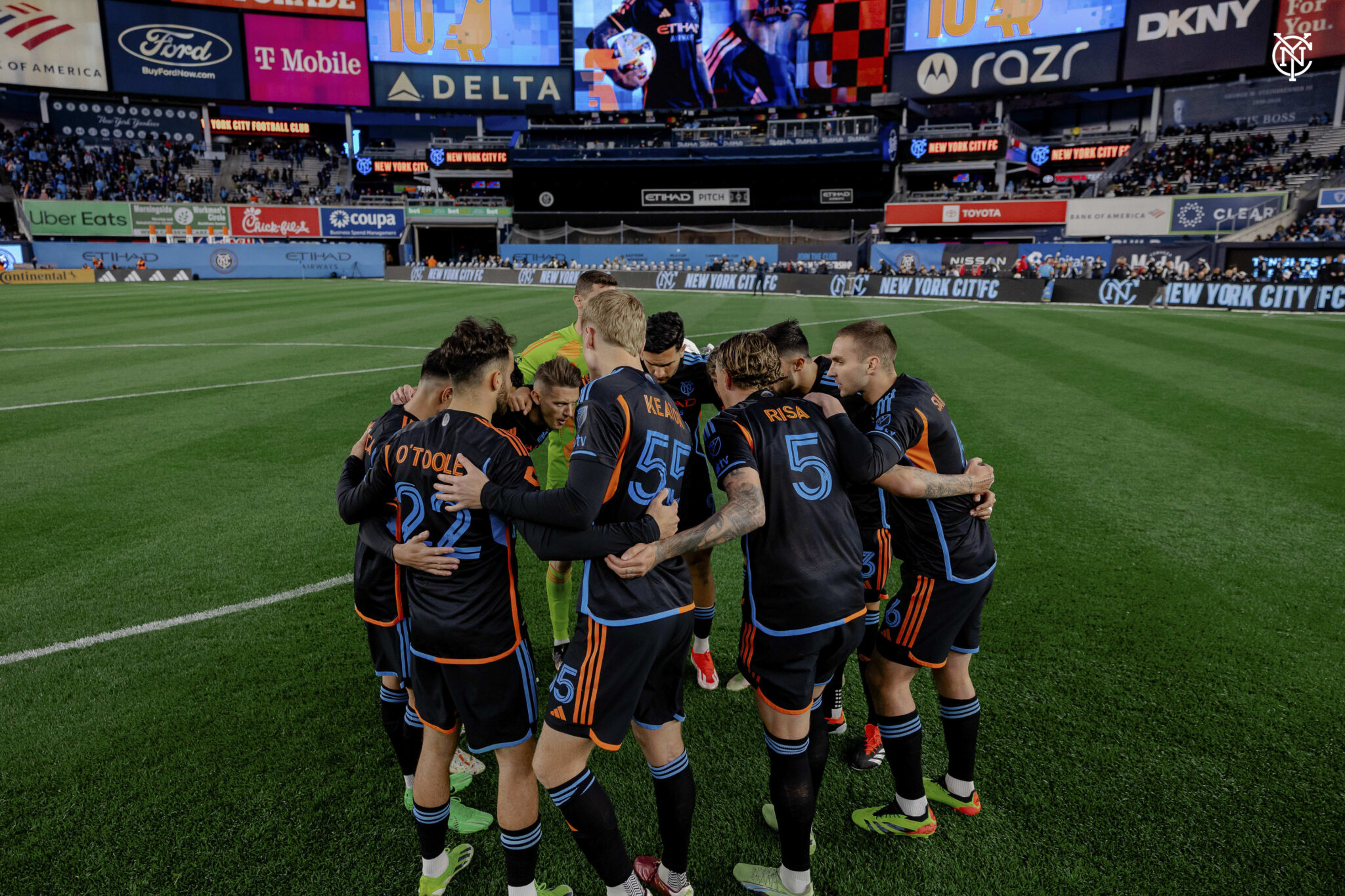 NYCFC team huddles during the game